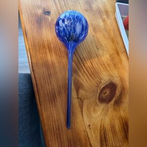 Blue glass watering globe